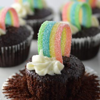 Super moist whole wheat chocolate cupcakes, with rainbows on top to make them a perfect recipe for St.Patrick’s Day