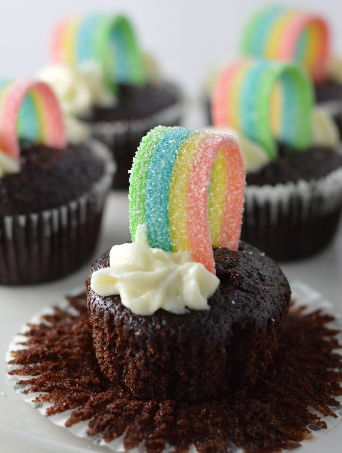 Super moist whole wheat chocolate cupcakes, with rainbows on top to make them a perfect recipe for St.Patrick’s Day