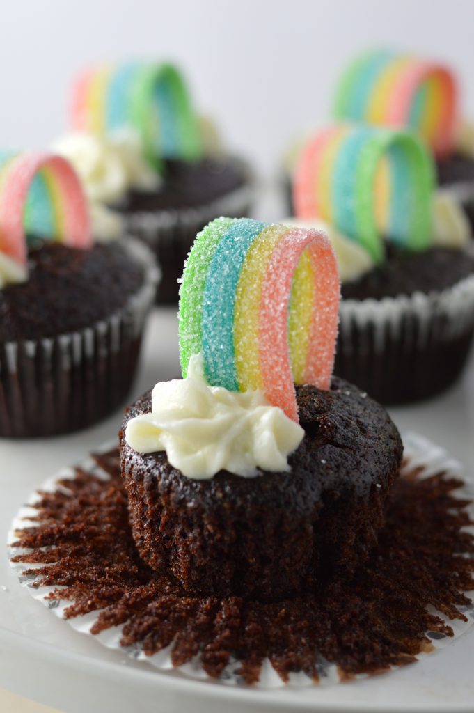 Super moist whole wheat chocolate cupcakes, with rainbows on top to make them a perfect recipe for St.Patrick’s Day