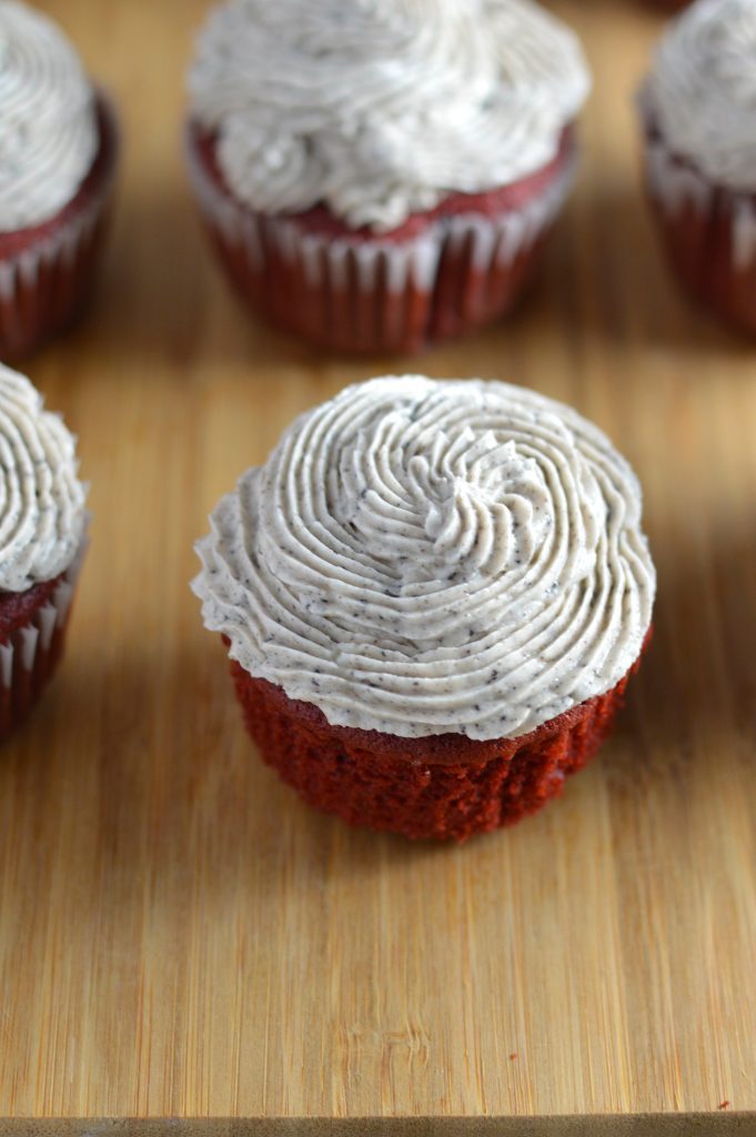 Red velvet cupcakes with an Oreo surprise inside. Topped with cookies and cream frosting.