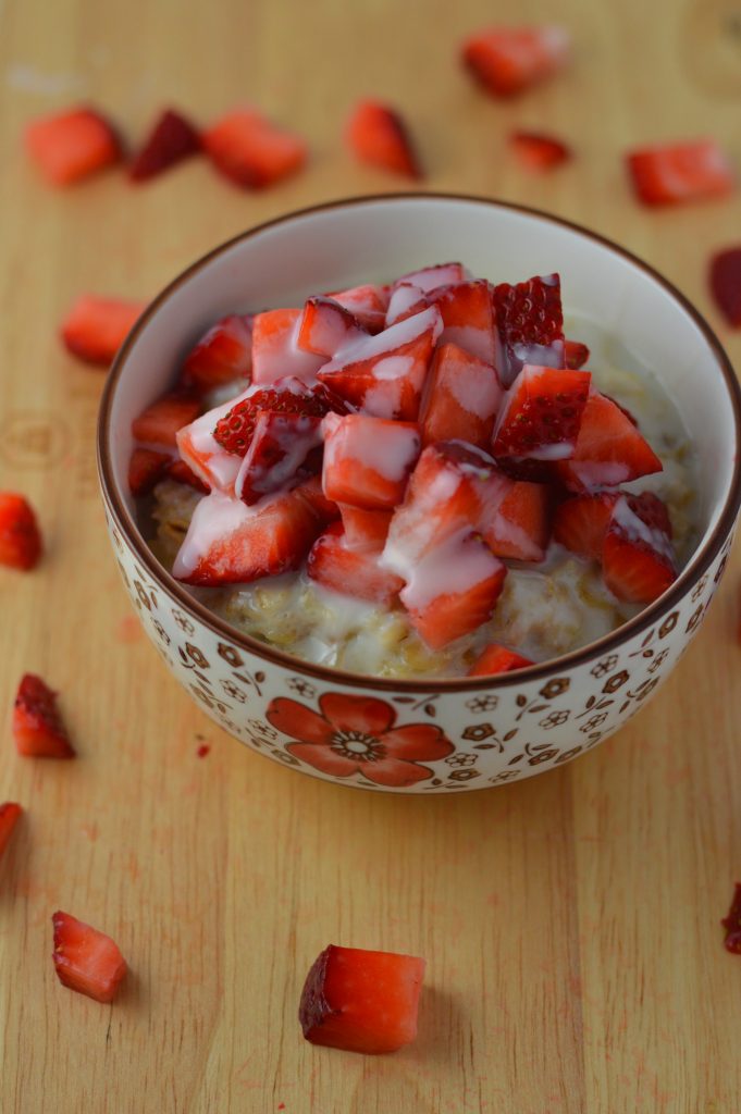 Healthy strawberries and cream oatmeal. Made with 4 ingredients, and ready in under 15 minutes.