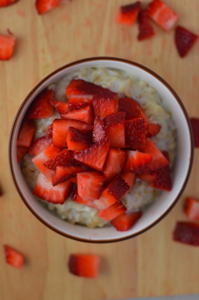 Healthy strawberries and cream oatmeal. Made with 4 ingredients, and ready in under 15 minutes.