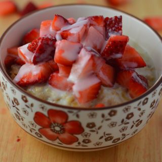 Healthy strawberries and cream oatmeal. Made with 4 ingredients, and ready in under 15 minutes.