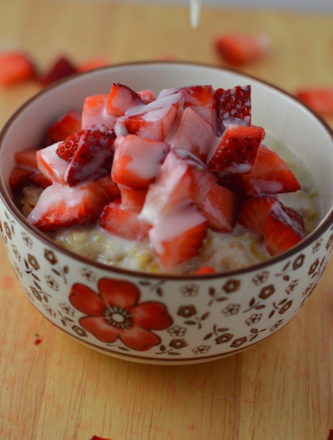 Healthy strawberries and cream oatmeal. Made with 4 ingredients, and ready in under 15 minutes.