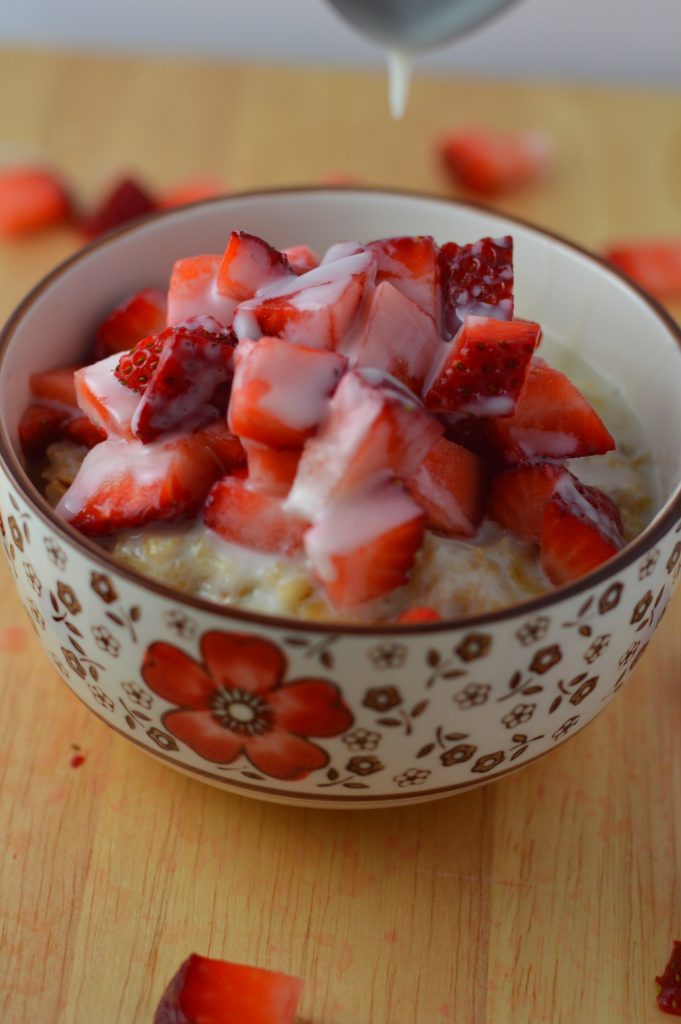 Healthy strawberries and cream oatmeal. Made with 4 ingredients, and ready in under 15 minutes.