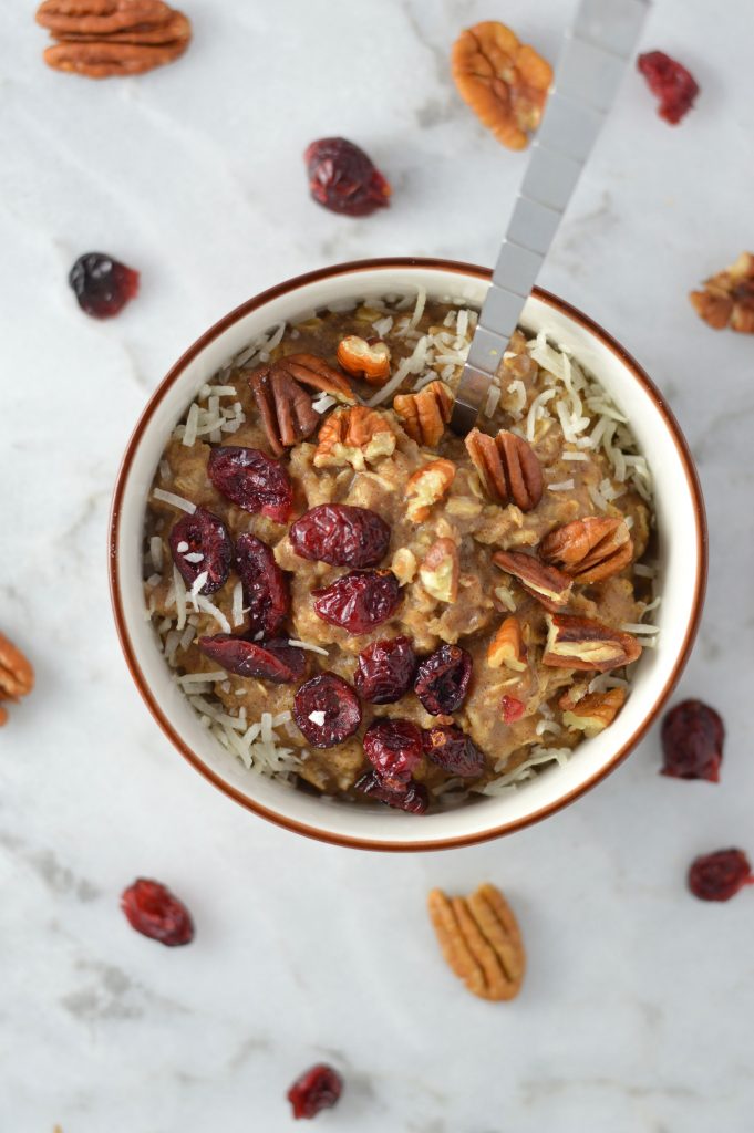 Pecan, Cranberry and Banana Oatmeal recipe that is ready in 10 minutes. With cinnamon and coconut added, it tastes like fall in a bowl.