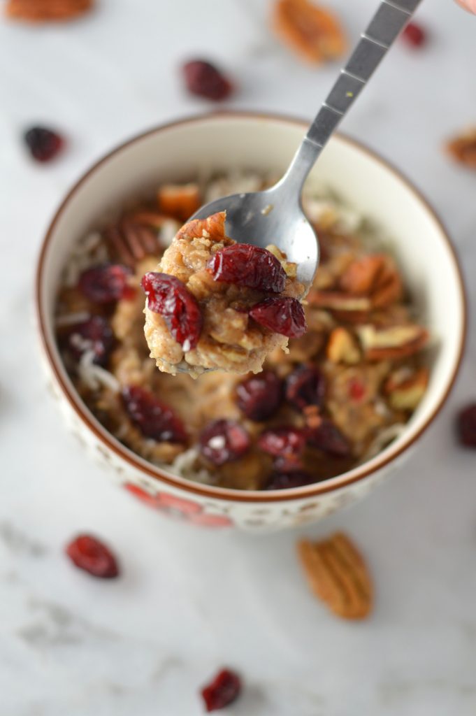 Pecan, Cranberry and Banana Oatmeal recipe that is ready in 10 minutes. With cinnamon and coconut added, it tastes like fall in a bowl.