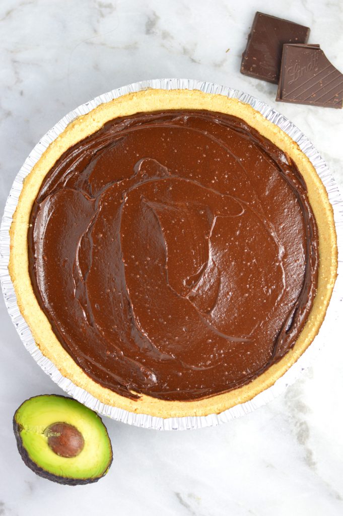 Vegan Chocolate, Peanut Butter and Avocado Pie recipe that is gluten free and so quick and easy to make. Rich and fudgy dessert idea.