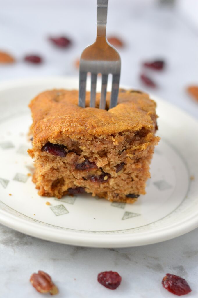 This Applesauce Cake is made with pecans and cranberries. The perfect dessert or breakfast recipe for the fall.