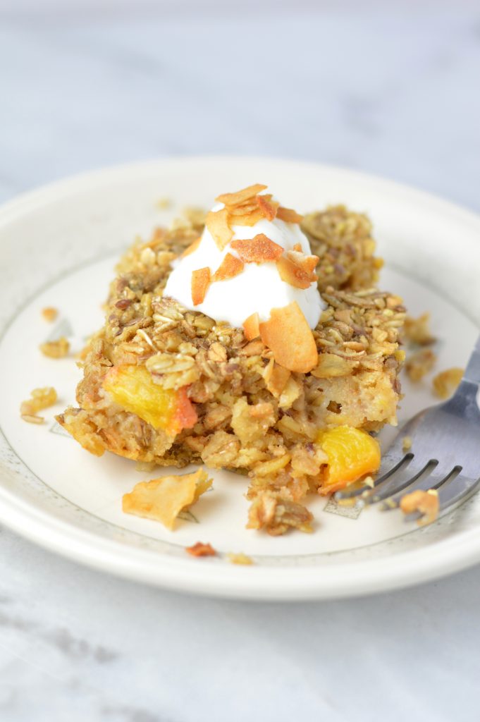 This Ginger Peach Baked Oatmeal is the perfect recipe idea for breakfast. Ready in 30 minutes. Best when topped with yogurt and coconut chips.