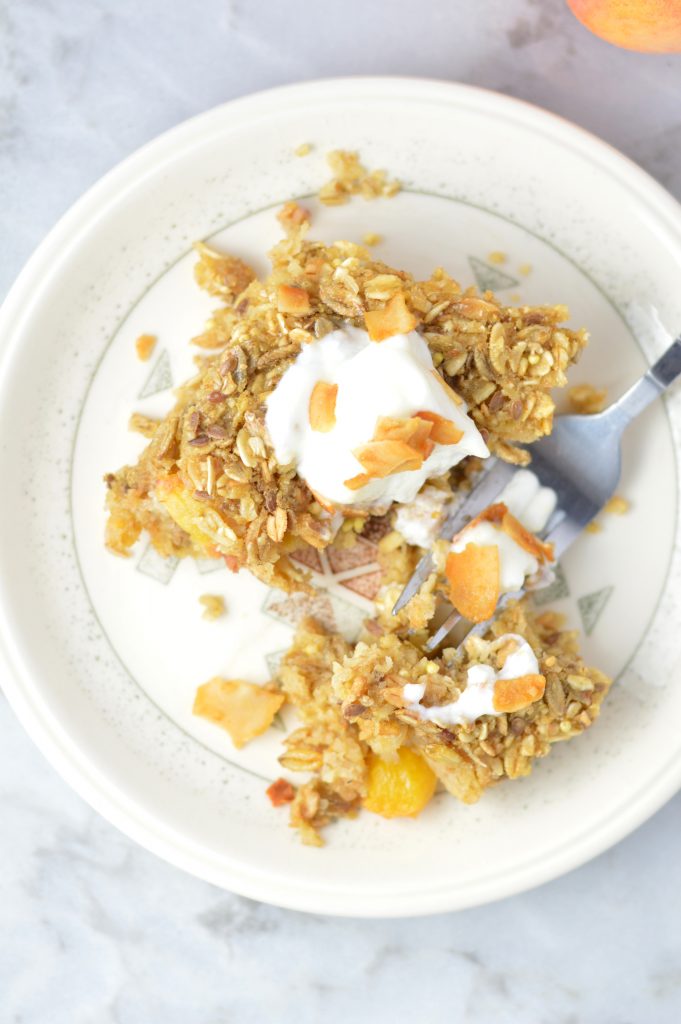 This Ginger Peach Baked Oatmeal is the perfect recipe idea for breakfast. Ready in 30 minutes. Best when topped with yogurt and coconut chips.