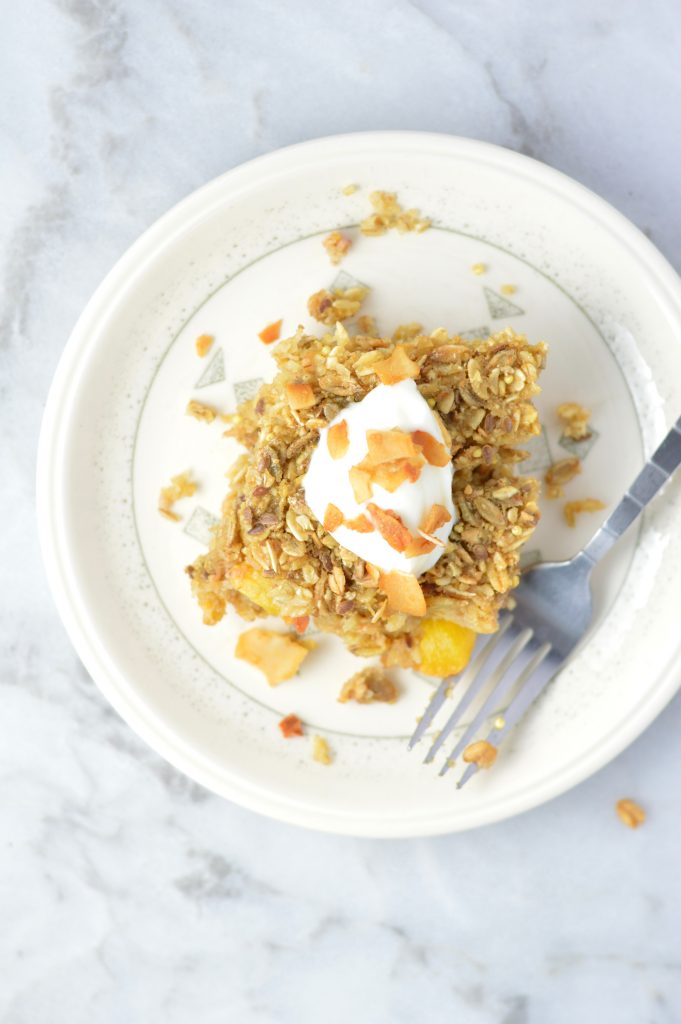 This Ginger Peach Baked Oatmeal is the perfect recipe idea for breakfast. Ready in 30 minutes. Best when topped with yogurt and coconut chips.