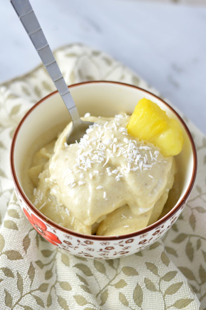 Easy 4 ingredient Pina Colada Nice Cream that is ready in under 5 minutes. It's a banana ice cream, so it is vegan, gluten free and paleo.