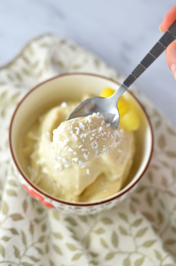 Easy 4 ingredient Pina Colada Nice Cream that is ready in under 5 minutes. It's a banana ice cream, so it is vegan, gluten free and paleo.