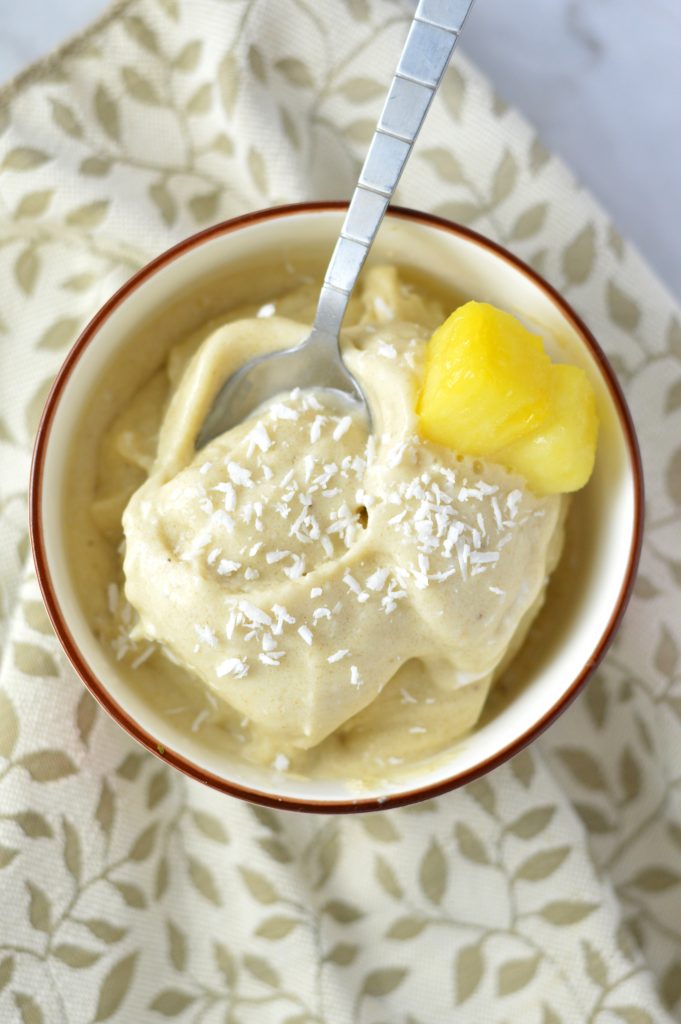 Easy 4 ingredient Pina Colada Nice Cream that is ready in under 5 minutes. It's a banana ice cream, so it is vegan, gluten free and paleo.