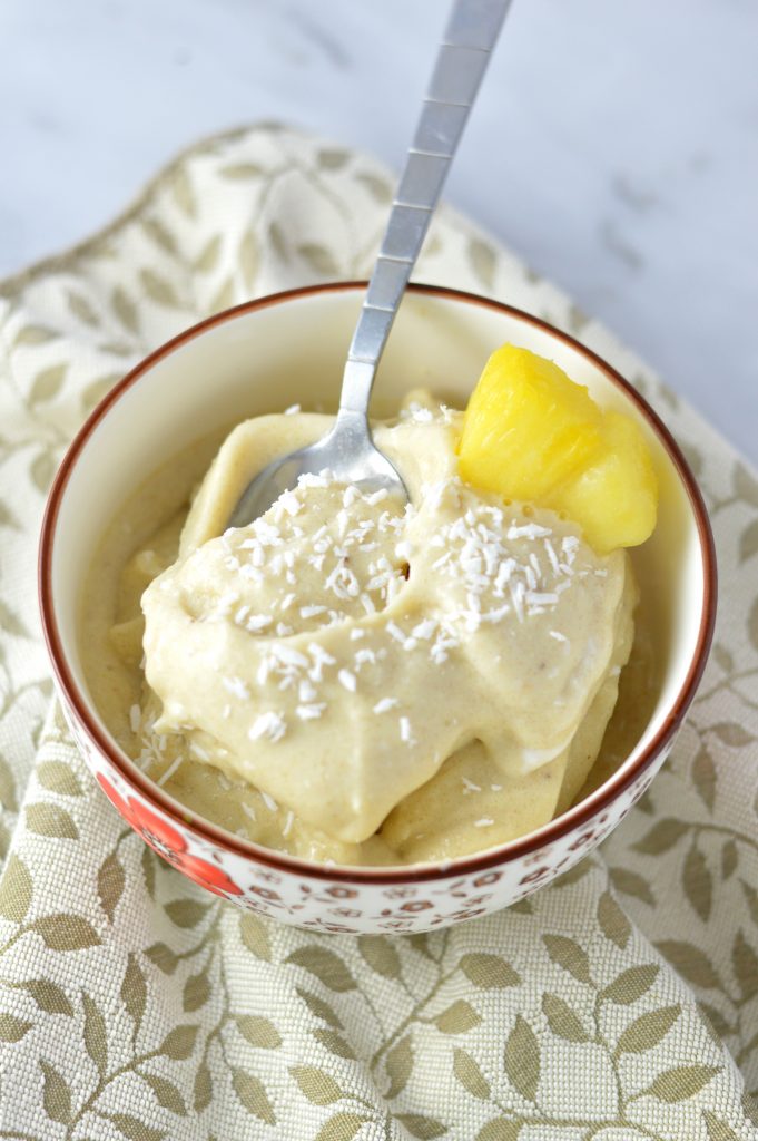 Easy 4 ingredient Pina Colada Nice Cream that is ready in under 5 minutes. It's a banana ice cream, so it is vegan, gluten free and paleo.