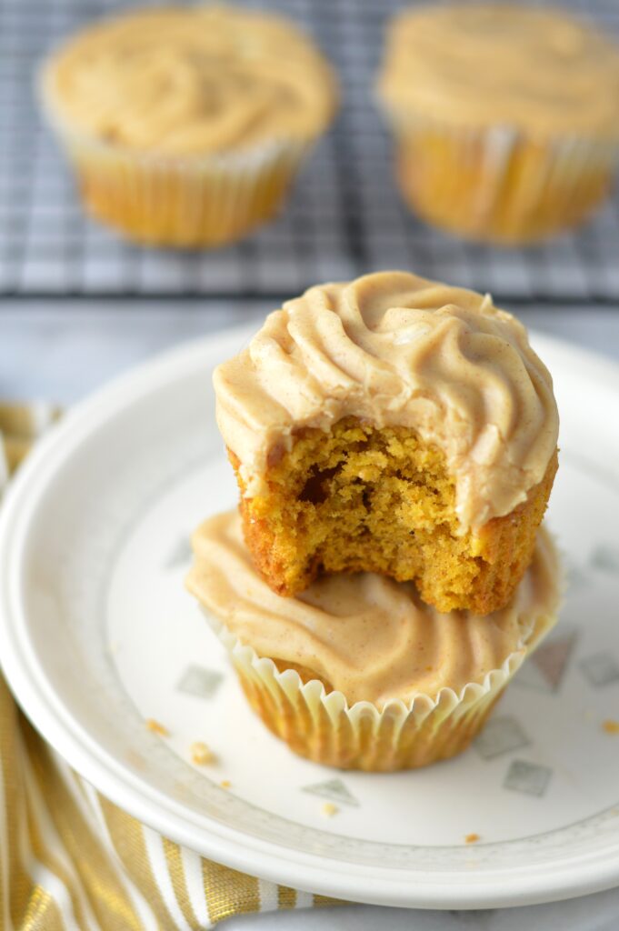 Pumpkin Spice Cupcakes recipe with pumpkin cinnamon cream cheese frosting. Super easy to make, this is a great fall dessert idea.