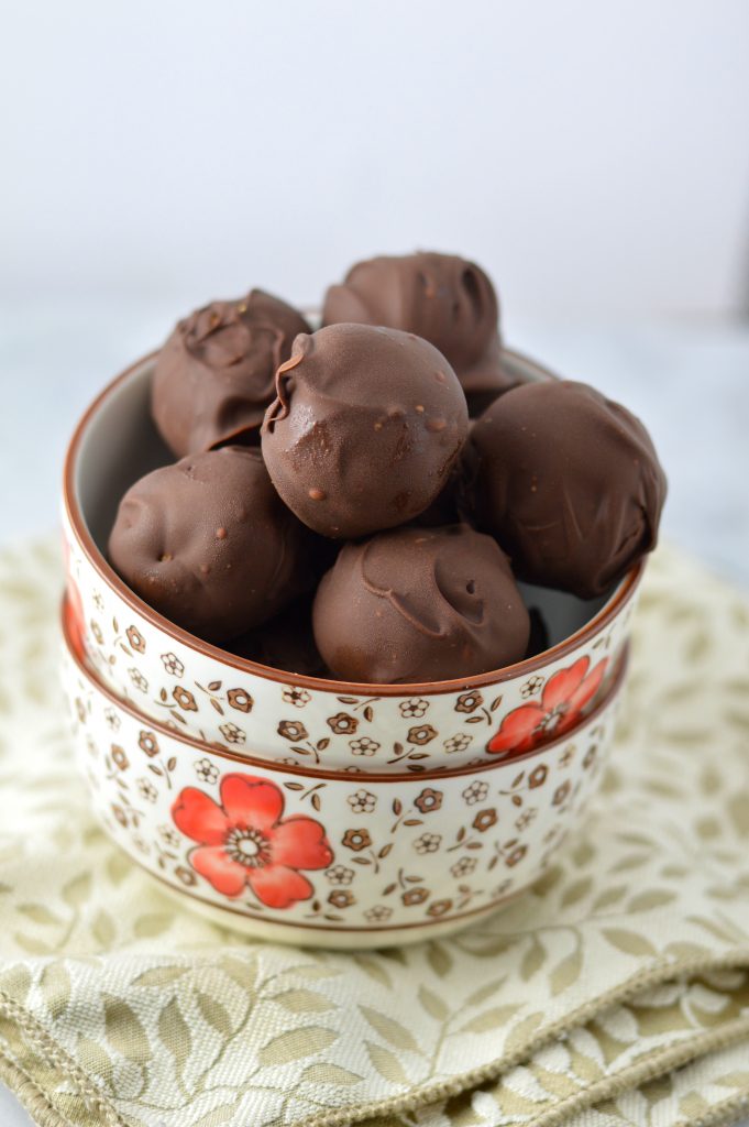 No Bake Vegan Coconut Flour Pumpkin Truffles recipe tastes like pumpkin pie, but so much better for you. Made with coconut butter and dark chocolate.