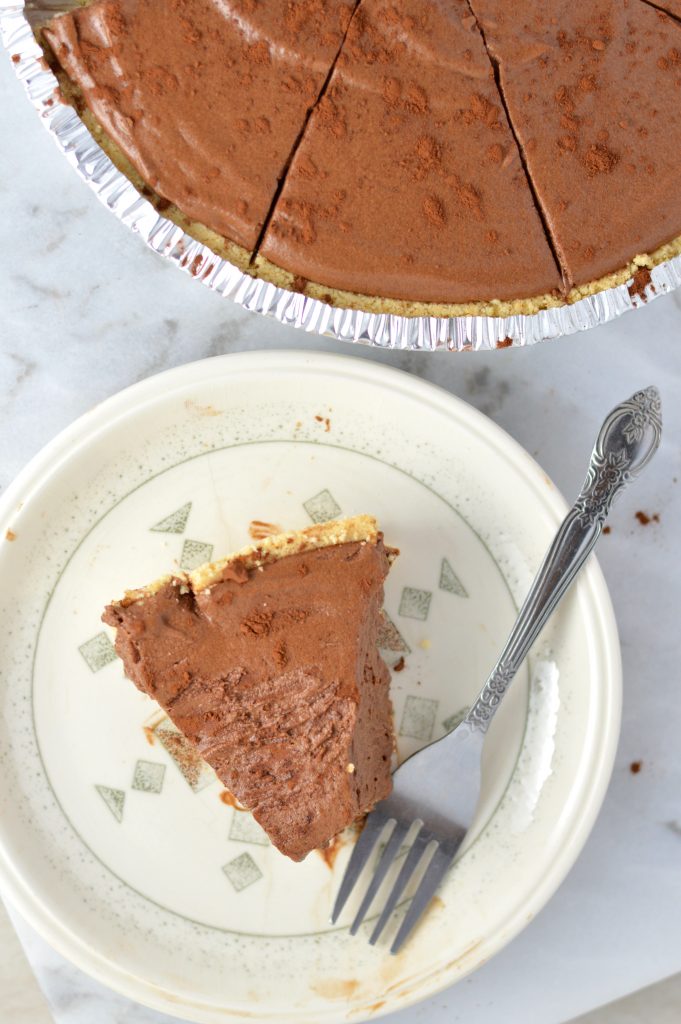 Rich No Bake Chocolate Truffle Pie is the perfect dessert recipe for a holiday party or to enjoy at home. Made with a graham cracker crust.