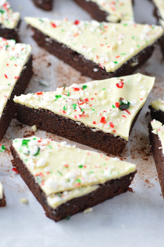 These Peppermint Bark Brownies are the perfect dessert recipe for Christmas. Soft and chewy brownies with a hard white chocolate shell topped with crushed candy canes.