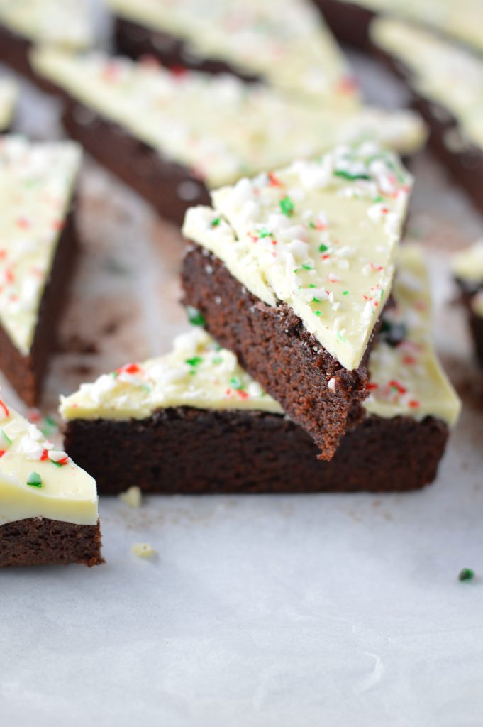 These Peppermint Bark Brownies are the perfect dessert recipe for Christmas. Soft and chewy brownies with a hard white chocolate shell topped with crushed candy canes.