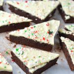 These Peppermint Bark Brownies are the perfect dessert recipe for Christmas. Soft and chewy brownies with a hard white chocolate shell topped with crushed candy canes.