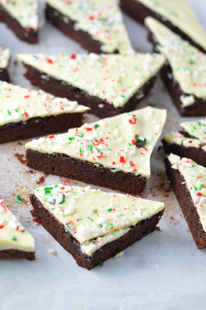 These Peppermint Bark Brownies are the perfect dessert recipe for Christmas. Soft and chewy brownies with a hard white chocolate shell topped with crushed candy canes.