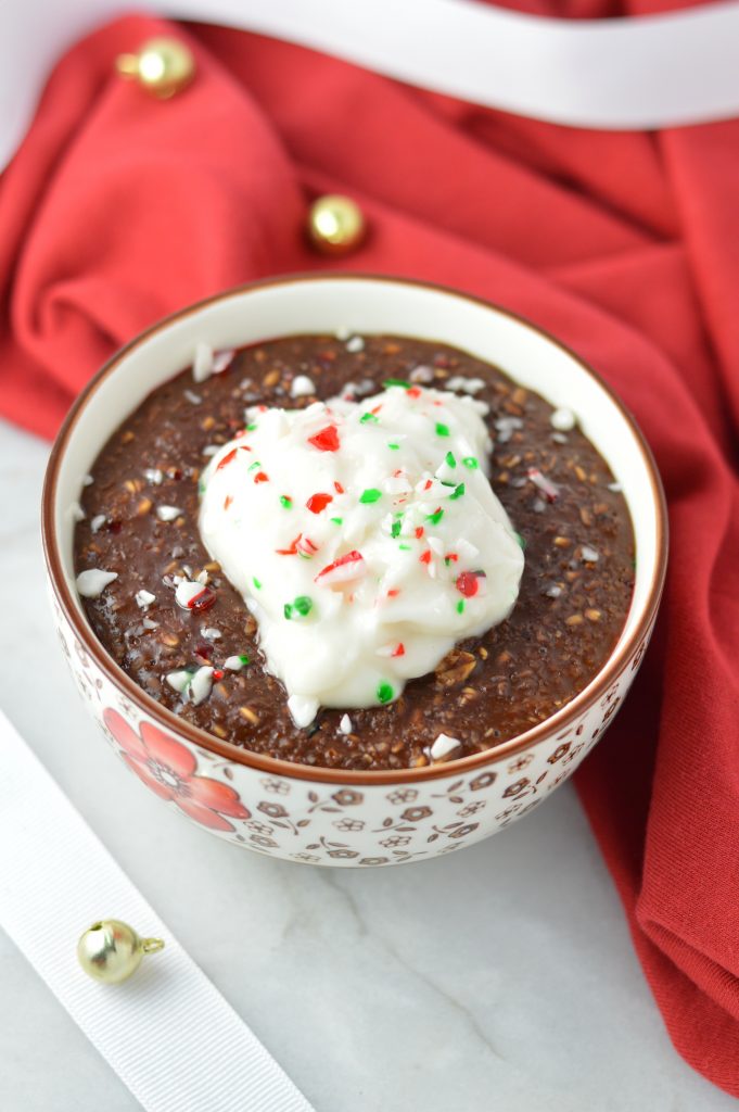 Peppermint Mocha Oatmeal makes for a warm and comforting breakfast recipe for the holidays. topped with yogurt and crushed candy canes.