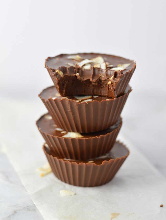 3 Ingredient Chocolate Peanut Butter Coconut Cups recipe makes for a quick and easy dessert idea. Made with coconut oil and topped with coconut chips,