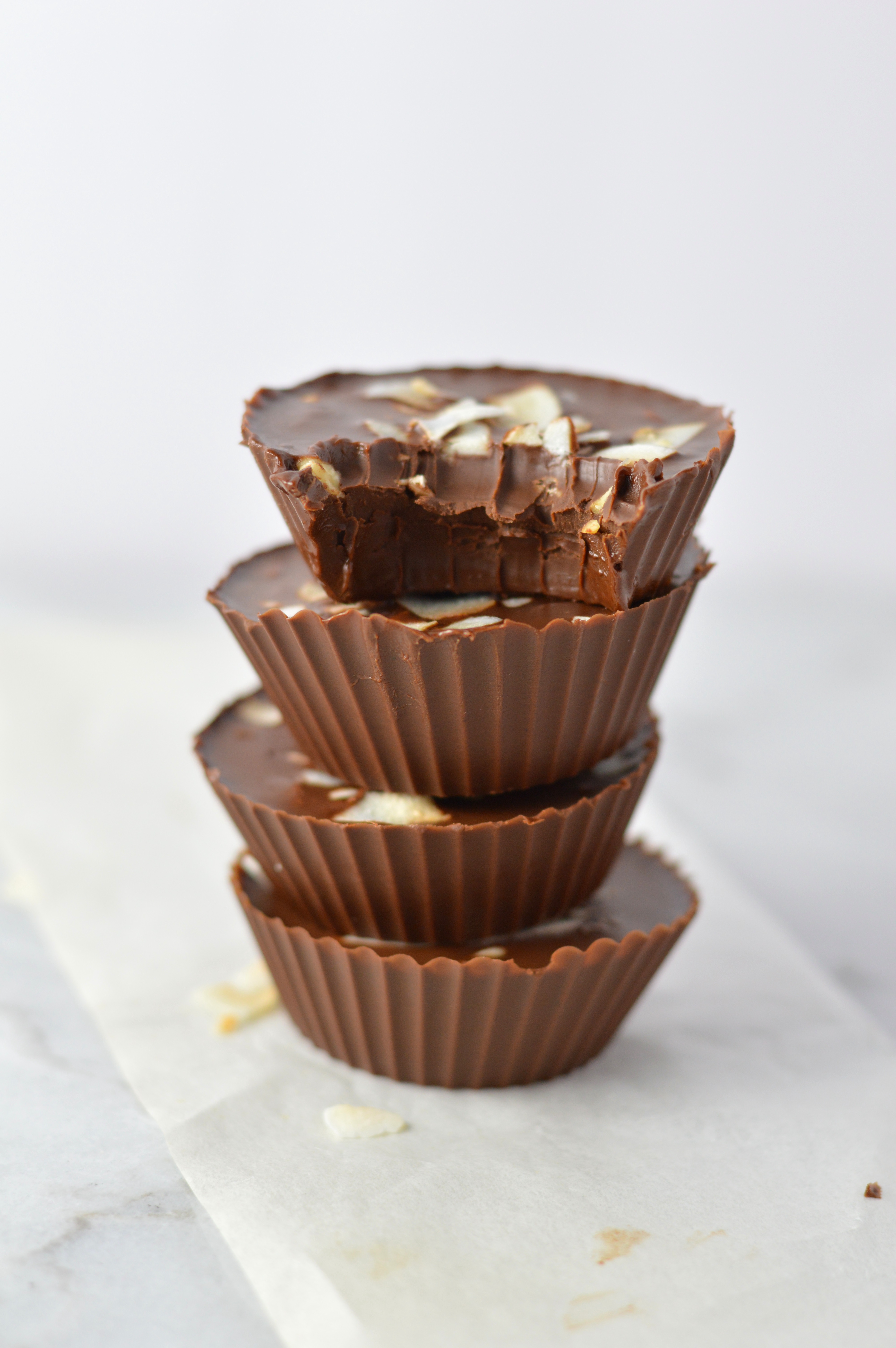 3 Ingredient Chocolate Peanut Butter Coconut Cups recipe makes for a quick and easy dessert idea. Made with coconut oil and topped with coconut chips,