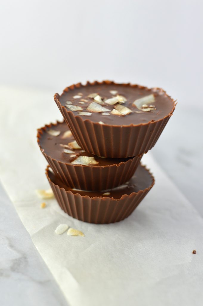 3 Ingredient Chocolate Peanut Butter Coconut Cups recipe makes for a quick and easy dessert idea. Made with coconut oil and topped with coconut chips,