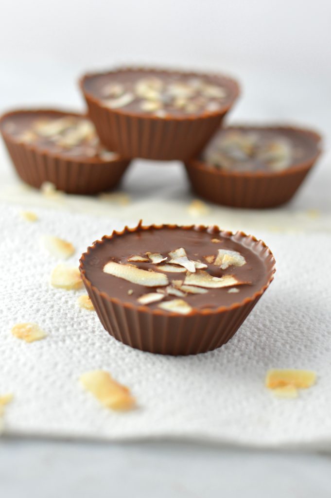 3 Ingredient Chocolate Peanut Butter Coconut Cups recipe makes for a quick and easy dessert idea. Made with coconut oil and topped with coconut chips,