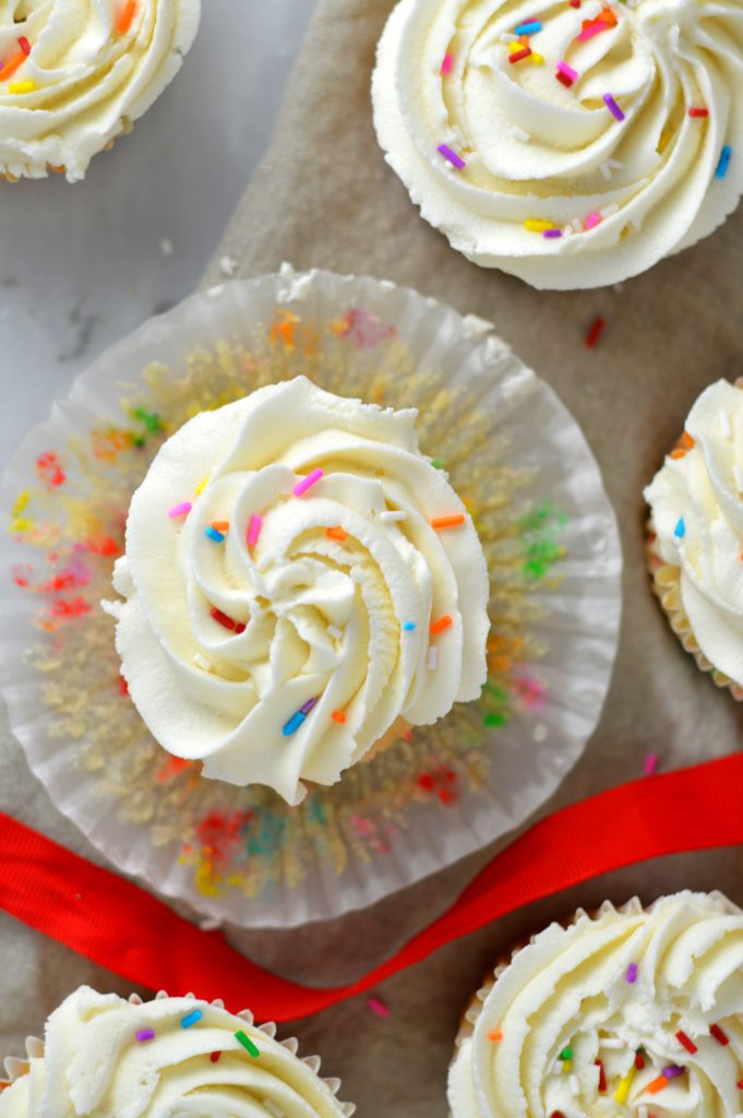 Easy Funfetti Cupcakes recipe. Birthday cake flavoured cupcakes filled with sprinkles and topped with the best buttercream. Perfect birthday dessert idea.