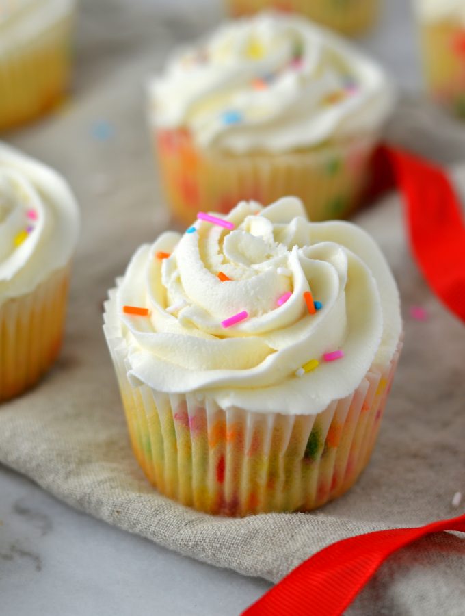 Easy Funfetti Cupcakes recipe. Birthday cake flavoured cupcakes filled with sprinkles and topped with the best buttercream. Perfect birthday dessert idea.