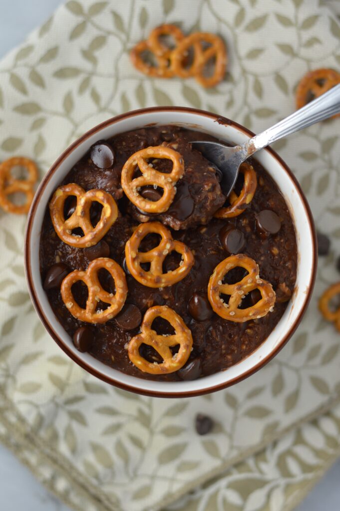 Pretzel Topped Brownie Oatmeal recipe is a quick and easy breakfast idea to keep you full until lunch. So rich and decadent, it feels like dessert without the guilt.