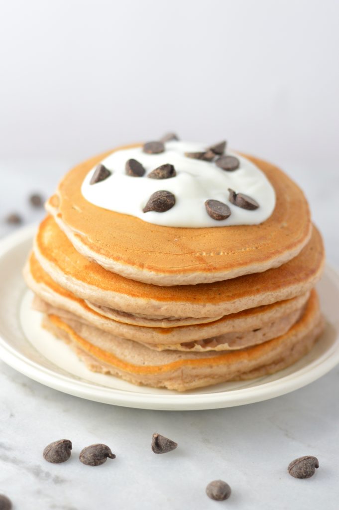 Easy Chocolate Protein Powder Pancakes recipe that can be made vegan. These are so quick to make, and so soft and fluffy. Perfect breakfast or brunch idea.