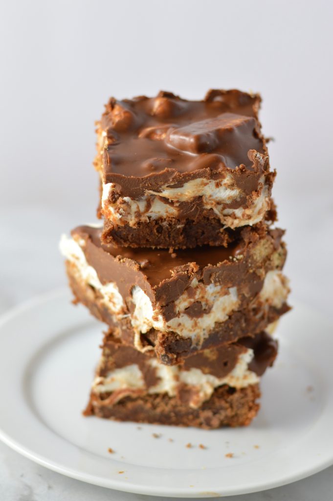 These Peanut Butter Smores Layered Brownies are in instant hit. This will be your new go-to brownie recipe for when you want a quick and easy dessert that looks fancy!