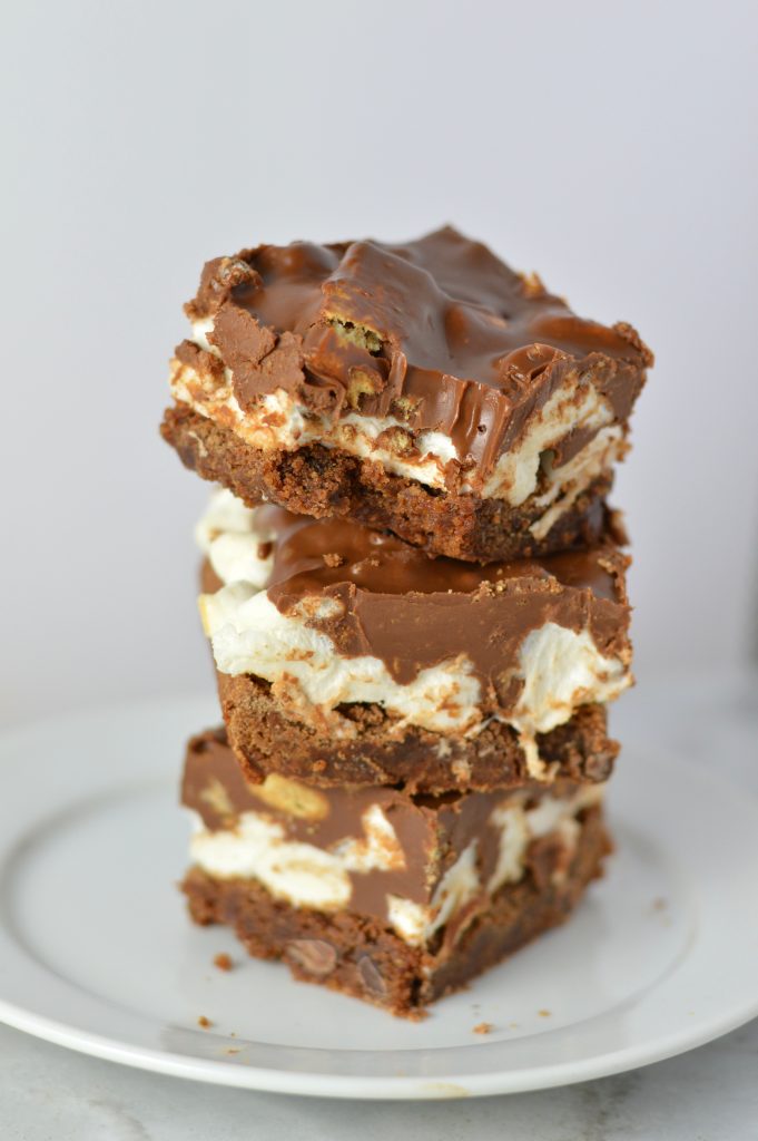 These Peanut Butter Smores Layered Brownies are in instant hit. This will be your new go-to brownie recipe for when you want a quick and easy dessert that looks fancy!