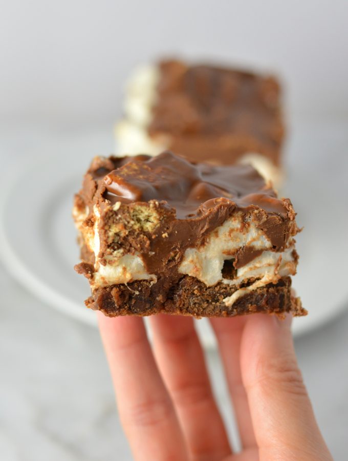 These Peanut Butter Smores Layered Brownies are in instant hit. This will be your new go-to brownie recipe for when you want a quick and easy dessert that looks fancy!