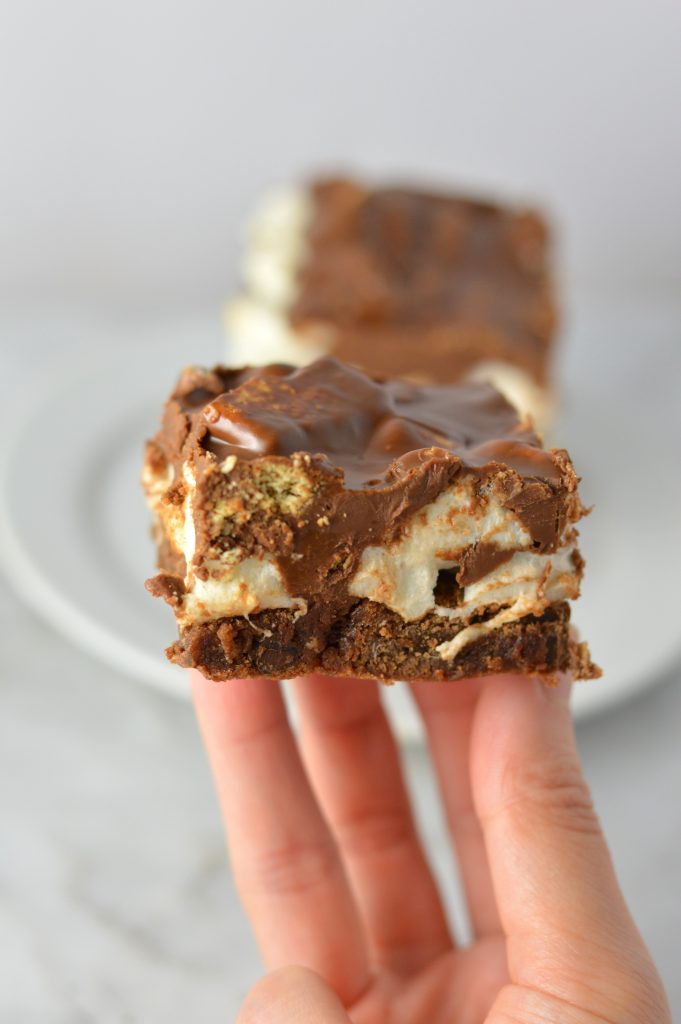 These Peanut Butter Smores Layered Brownies are in instant hit. This will be your new go-to brownie recipe for when you want a quick and easy dessert that looks fancy!