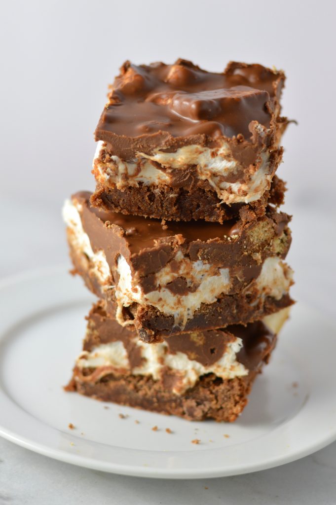 These Peanut Butter Smores Layered Brownies are in instant hit. This will be your new go-to brownie recipe for when you want a quick and easy dessert that looks fancy!