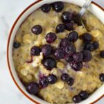 My favourite Blueberry Apple Holy Crap Oatmeal + Giveaway. The perfect breakfast recipe to keep you full until lunch. Lightly sweetened, gluten free and vegan.