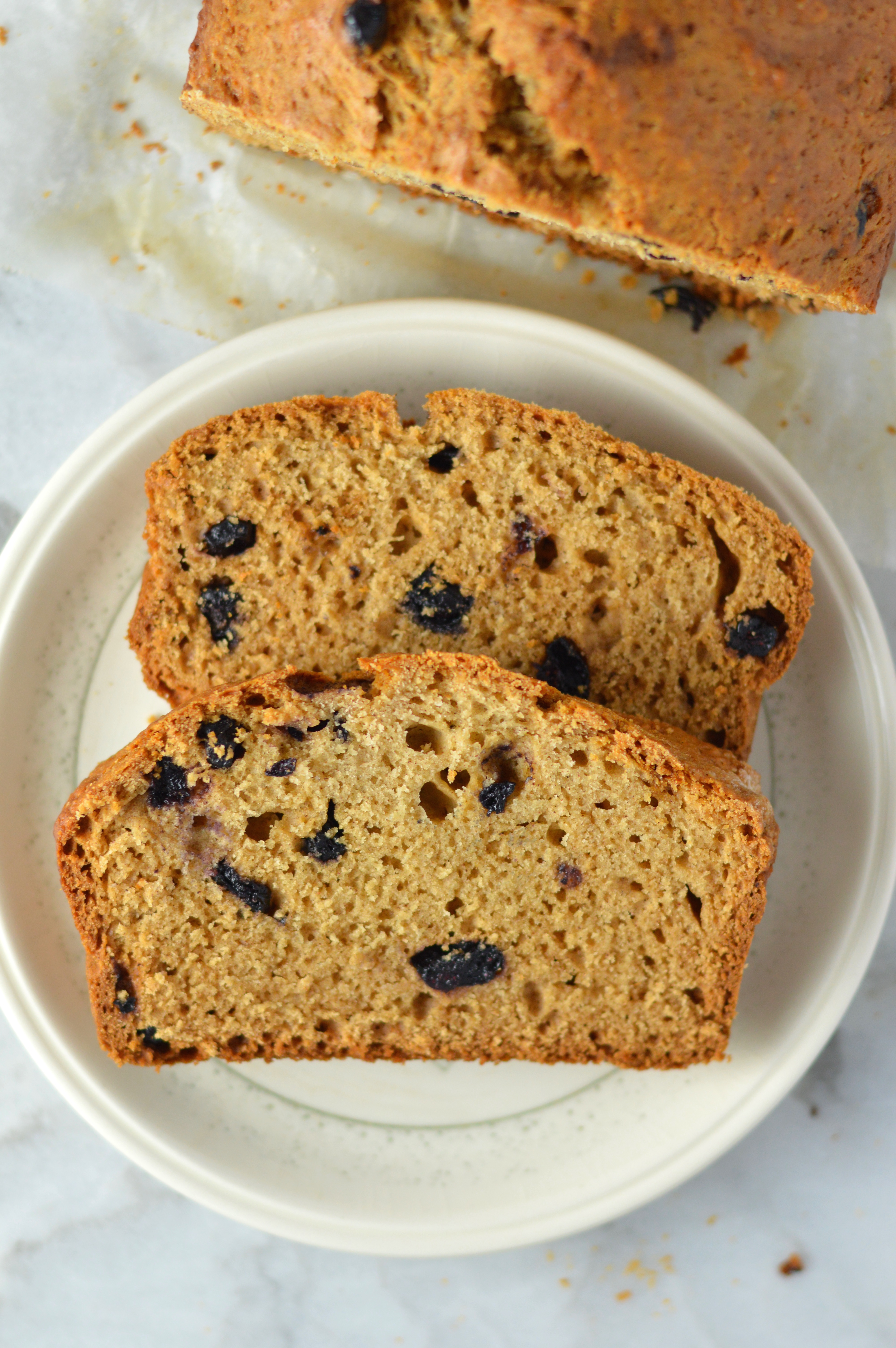 Easy Blueberry Applesauce Bread recipe. Super simple breakfast or nut free snack idea, and made with cinnamon and dried blueberries.