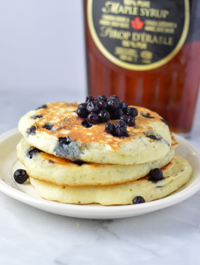 Fluffy Blueberry Pancakes recipe made with fresh blueberries. So easy to make, and somewhat healthy, they make a delicious filling breakfast idea.