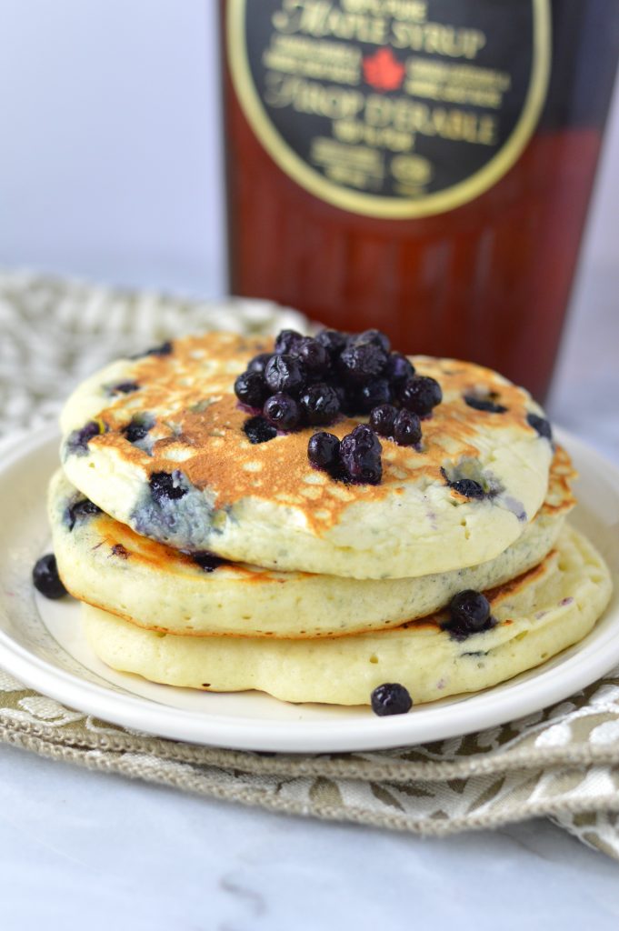 Fluffy Blueberry Pancakes recipe made with fresh blueberries. So easy to make, and somewhat healthy, they make a delicious filling breakfast idea.