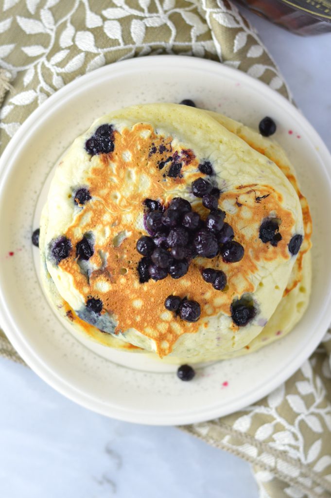 Fluffy Blueberry Pancakes recipe made with fresh blueberries. So easy to make, and somewhat healthy, they make a delicious filling breakfast idea.