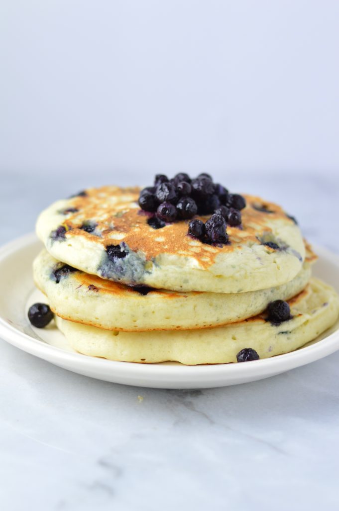 Fluffy Blueberry Pancakes recipe made with fresh blueberries. So easy to make, and somewhat healthy, they make a delicious filling breakfast idea.