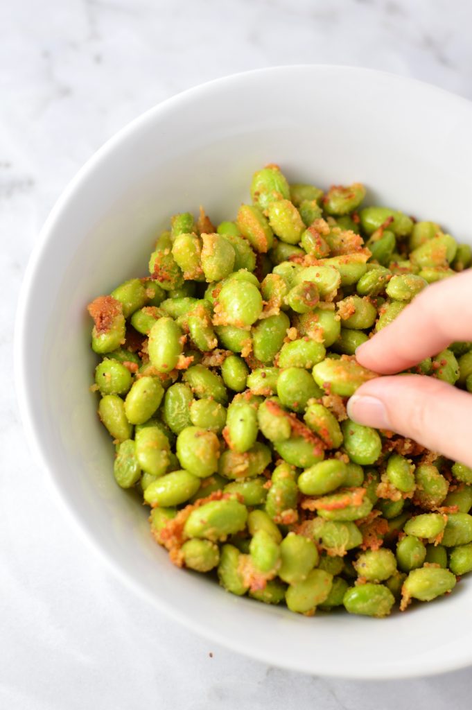 Healthy Roasted Parmesan Edamame recipe.Frozen edamame is baked in the oven to make a quick and easy appetizer or snack idea.