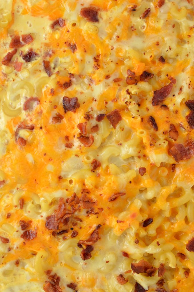 Creamy Baked Bacon Macaroni and Cheese that is so easy to make. My favourite weeknight dinner recipe idea made with cheddar and mozzarella.