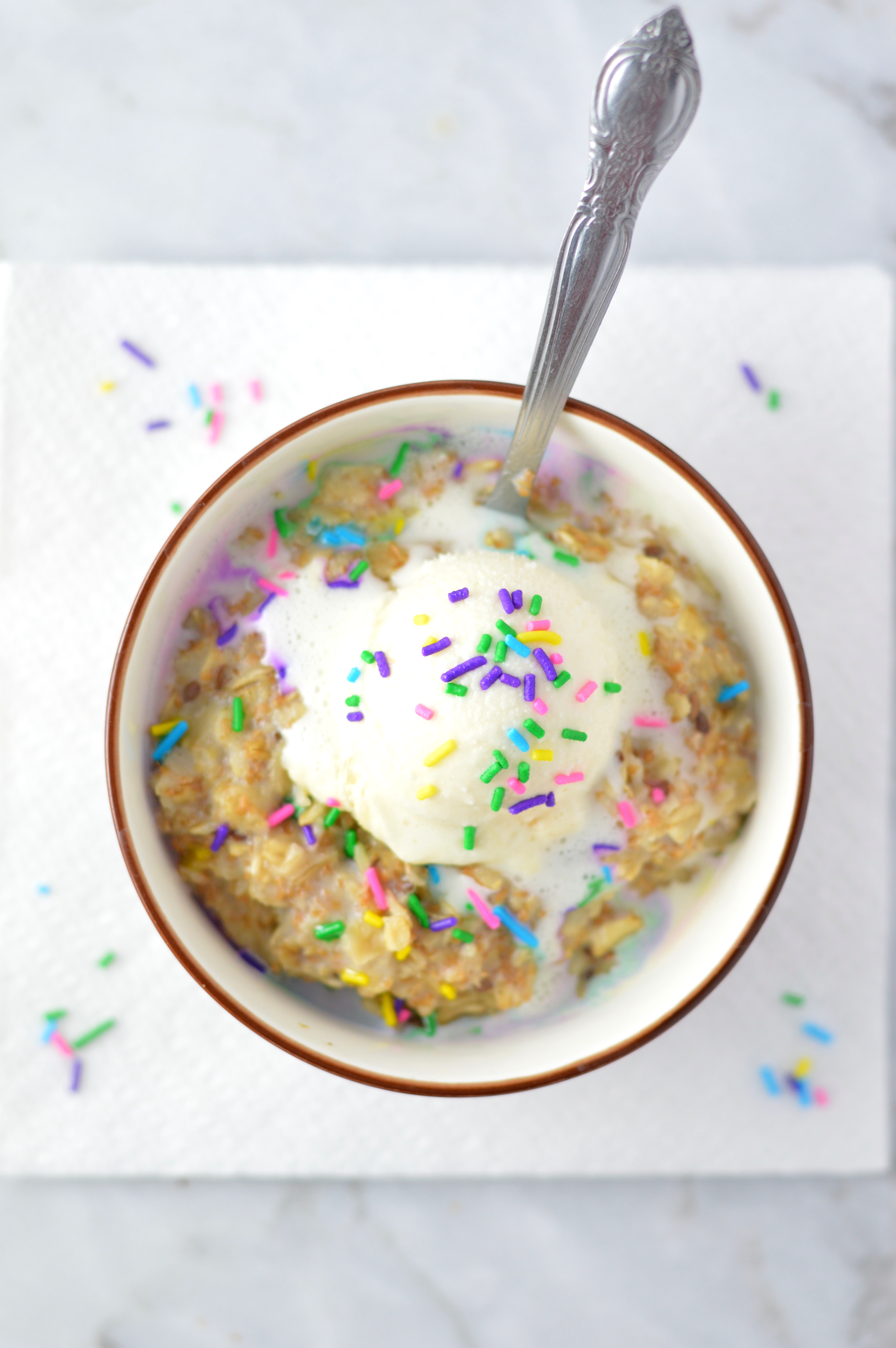 Easy Birthday Cake Oatmeal recipe for a quick and healthy way to celebrate your big day in the morning. Add ice cream if you want to make it extra special!